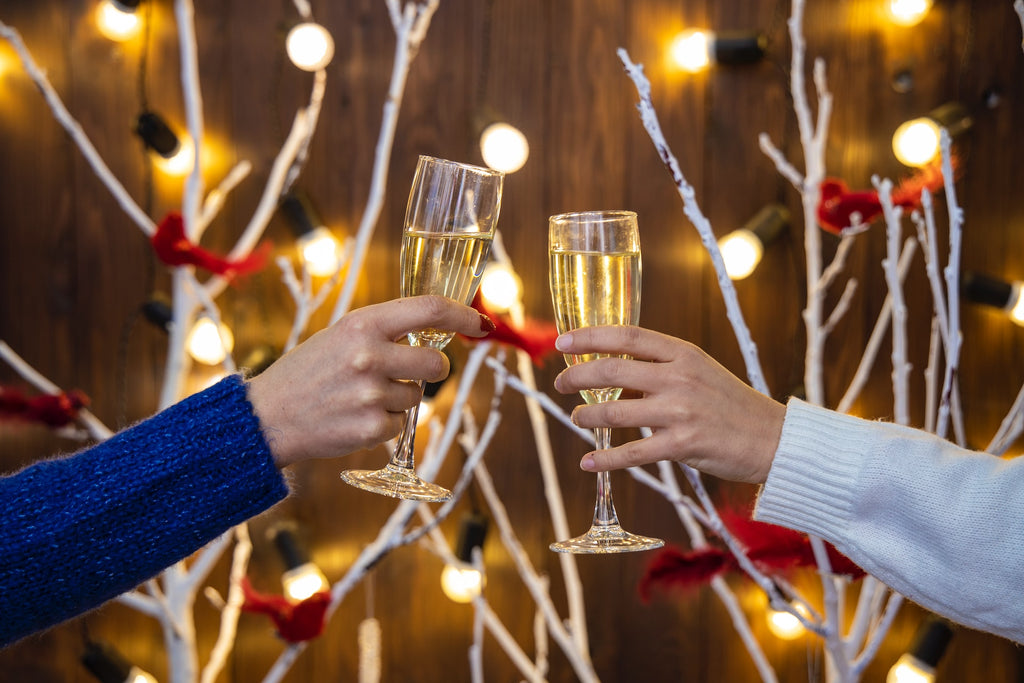 people toasting glasses at a holiday party