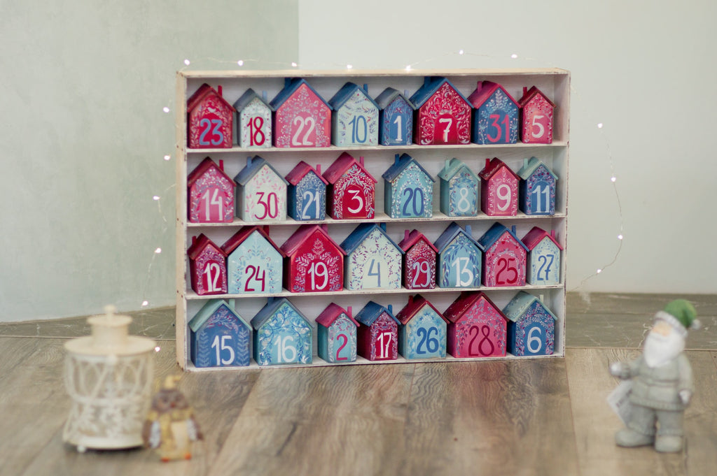 blue and red advent calendar with candles