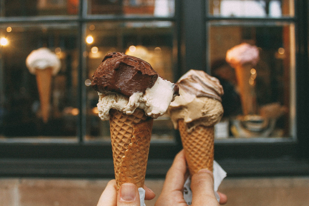 couple holding ice cream cones