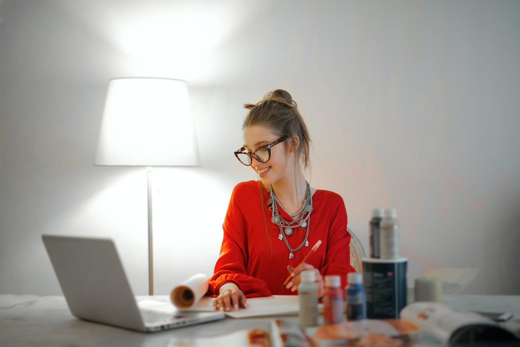 woman in home office with bright cool lighting