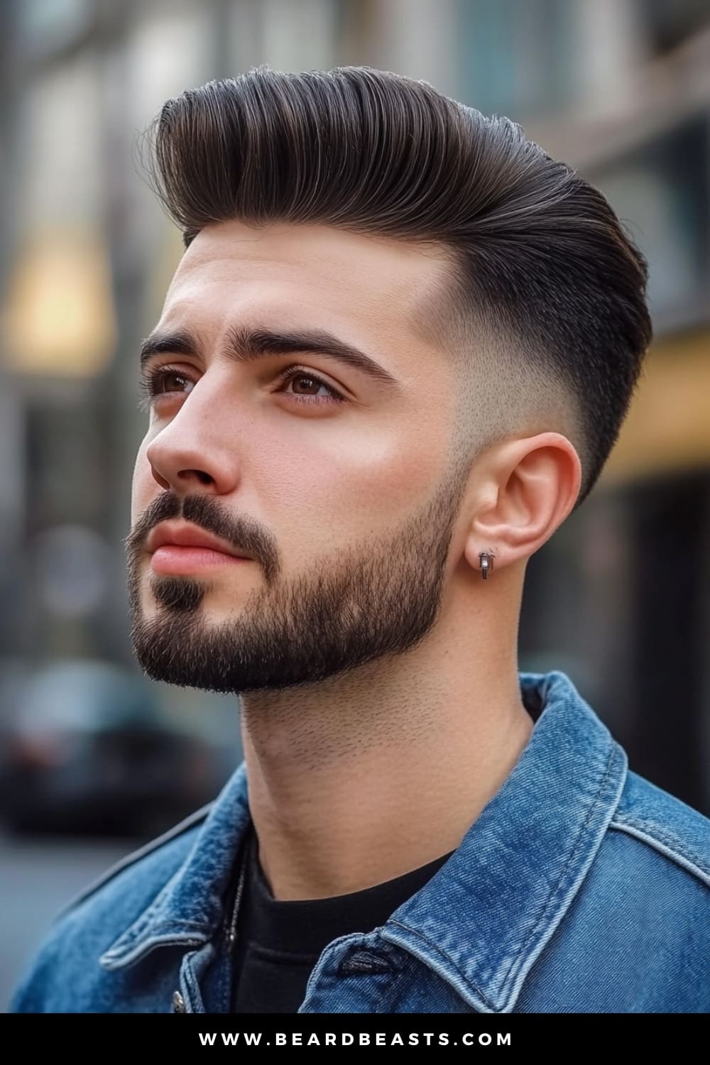 Close-up of a stylish young man sporting a classic Pompadour hairstyle, characterized by short sides and a voluminous, slicked-back top. This modern take on the timeless look highlights the popular men's short on sides, long on top haircuts trend, emphasizing sharp, clean lines and a polished appearance.